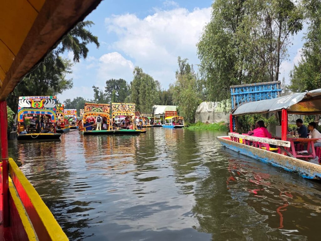 Brightly painted trajinera boats on the canals of Xochimilco, Mexico City
